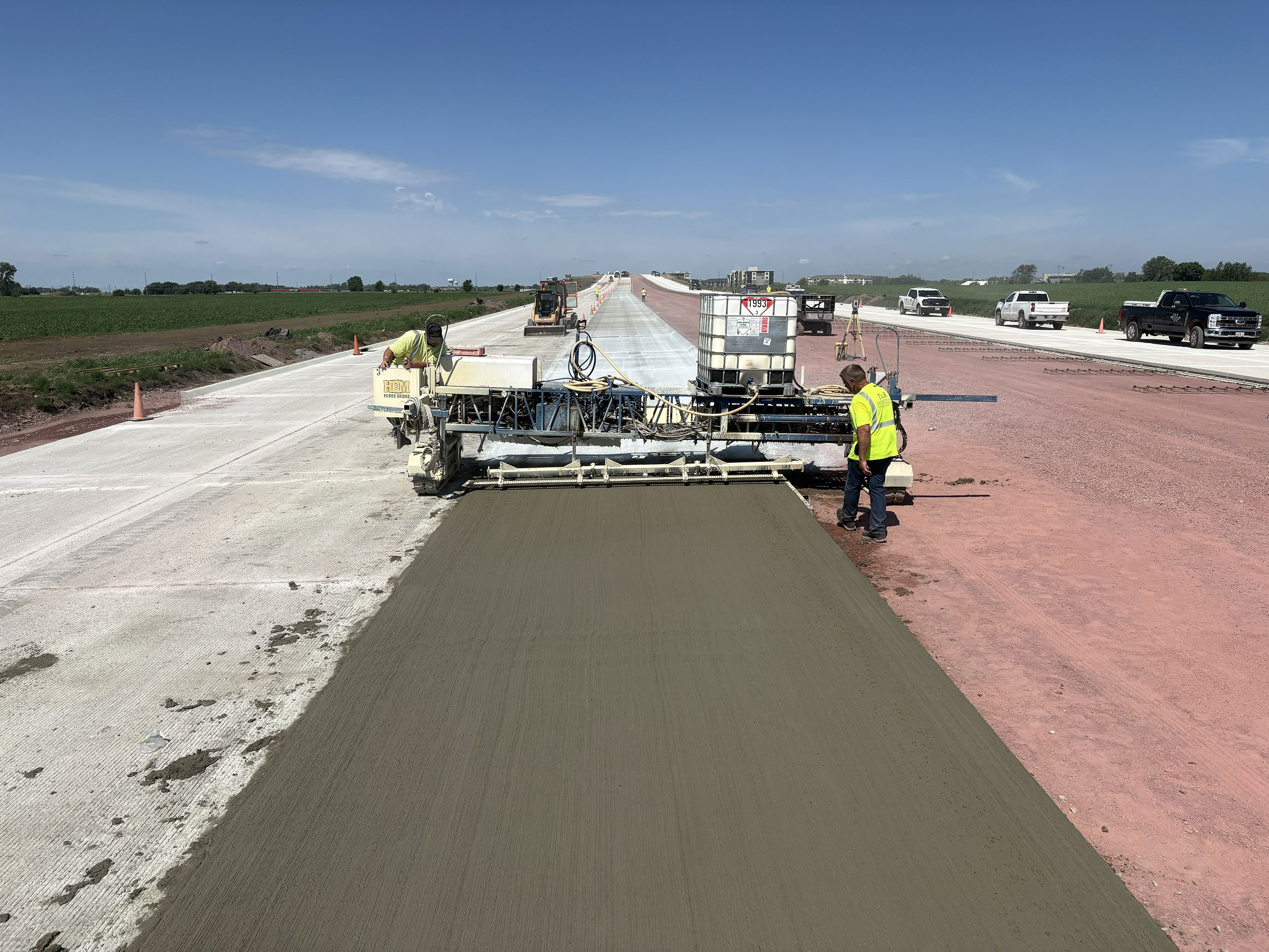 Placing concrete during paving operations between Sycamore Avenue and Southern Avenue. 